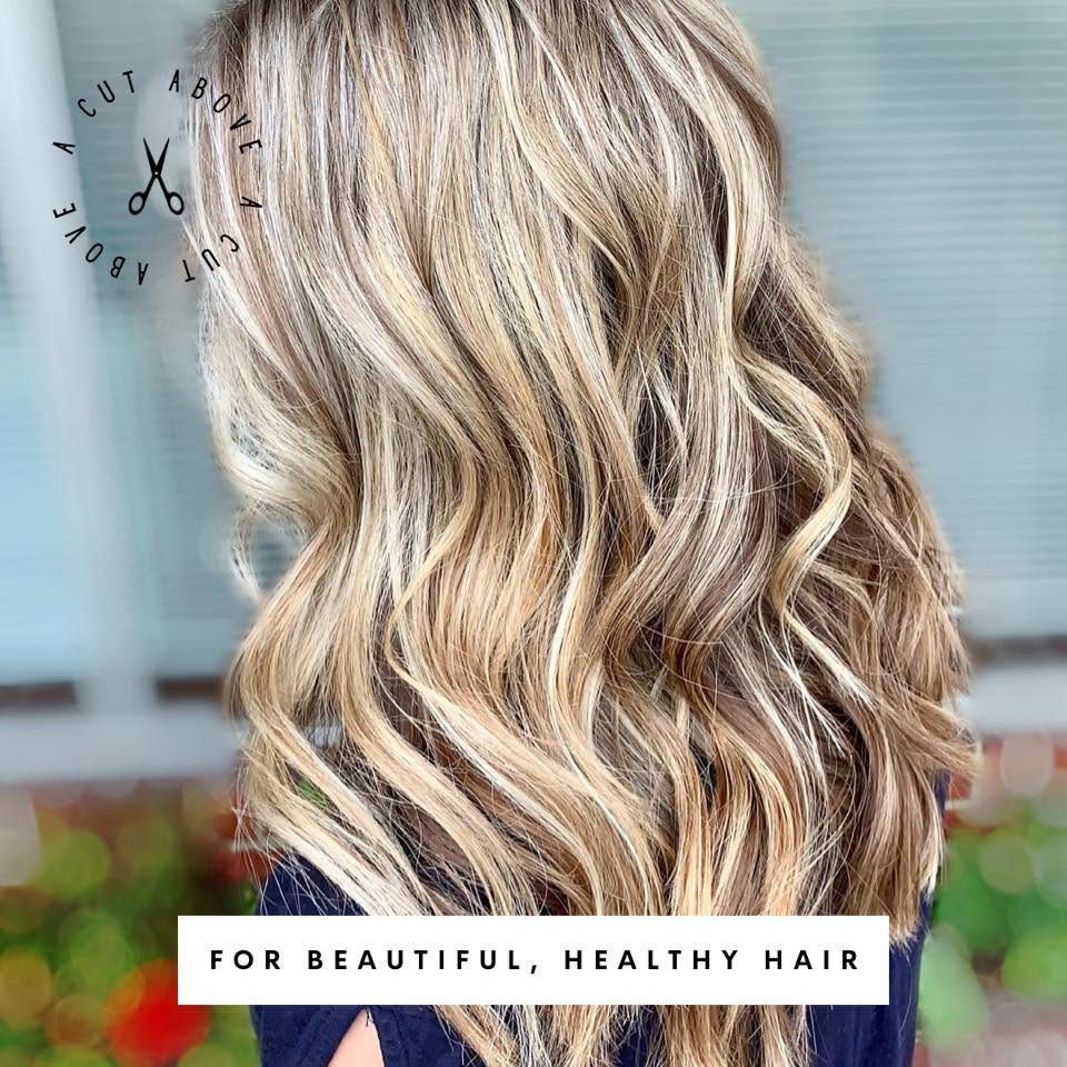Soft, hand-painted blonde balayage styled at DeLana's A Cut Above in Shallotte, NC.