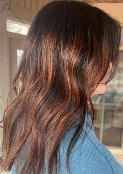 Warm auburn balayage color.