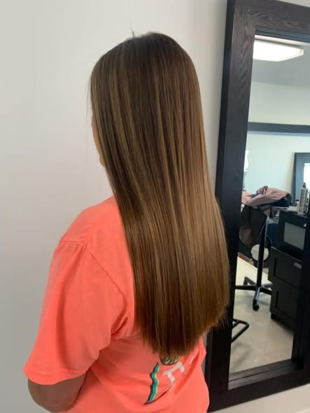Glossy straight brunette color.