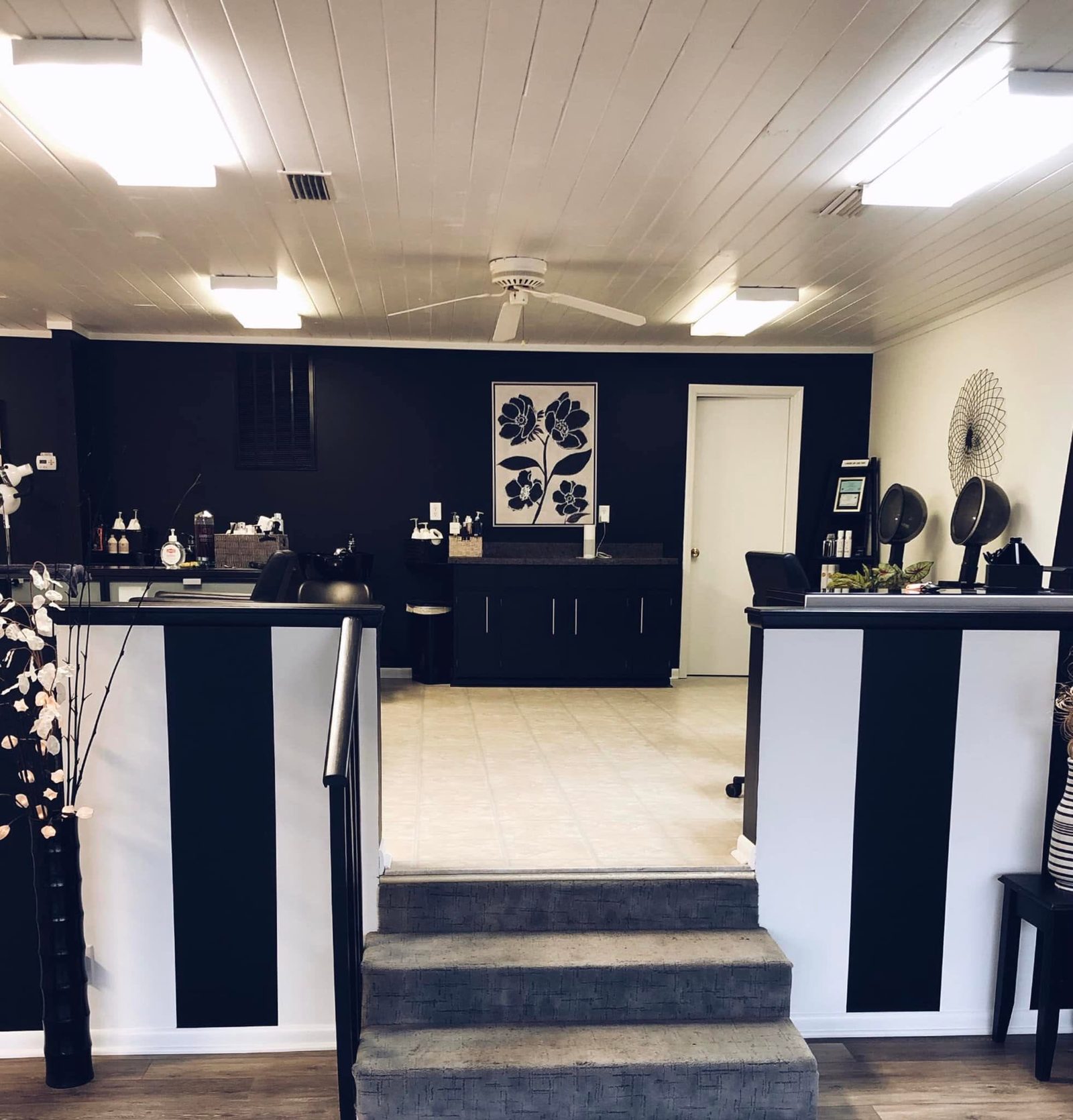 Inside the salon — black-and-white reception and retail area.