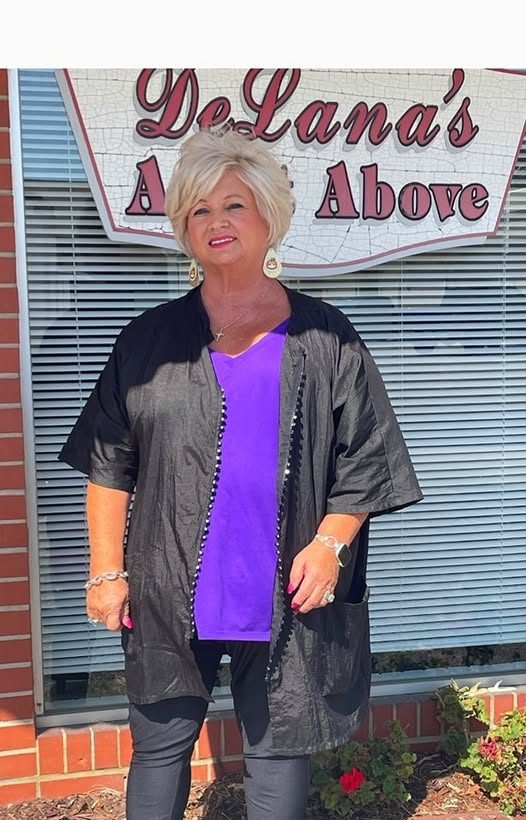 Owner DeLana outside the DeLana's A Cut Above storefront on Main Street.